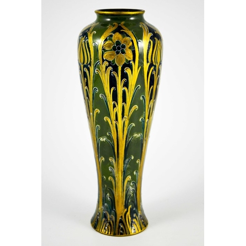 1105 - William Moorcroft for James MacIntyre, a Green and Gold Florian Ware vase, circa 1903, elongated inv... 