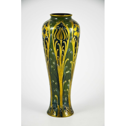 1105 - William Moorcroft for James MacIntyre, a Green and Gold Florian Ware vase, circa 1903, elongated inv... 