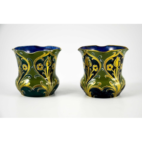 1107 - William Moorcroft for James MacIntyre, a mateched pair of Green and Gold Florian Ware vases, circa 1... 