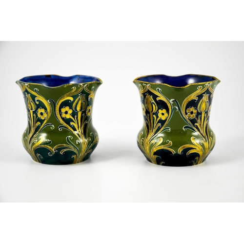 1107 - William Moorcroft for James MacIntyre, a mateched pair of Green and Gold Florian Ware vases, circa 1... 