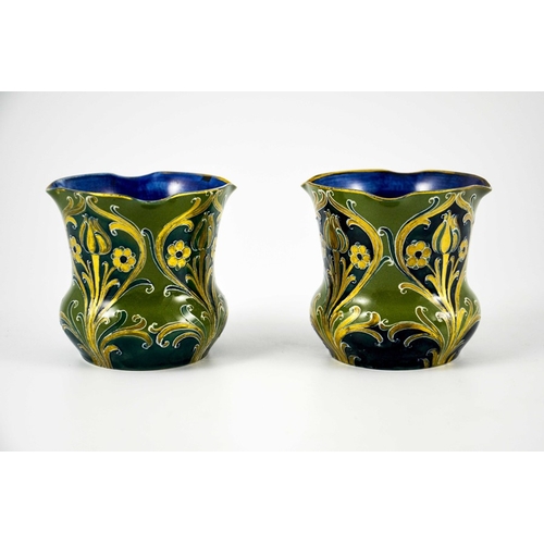 1107 - William Moorcroft for James MacIntyre, a mateched pair of Green and Gold Florian Ware vases, circa 1... 