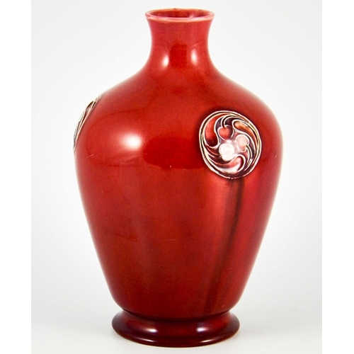 1118 - William Moorcroft for Liberty and Co., a Flamminian red vase, circa 1906, footed ovoid shouldered fo... 