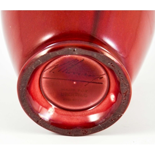 1118 - William Moorcroft for Liberty and Co., a Flamminian red vase, circa 1906, footed ovoid shouldered fo... 