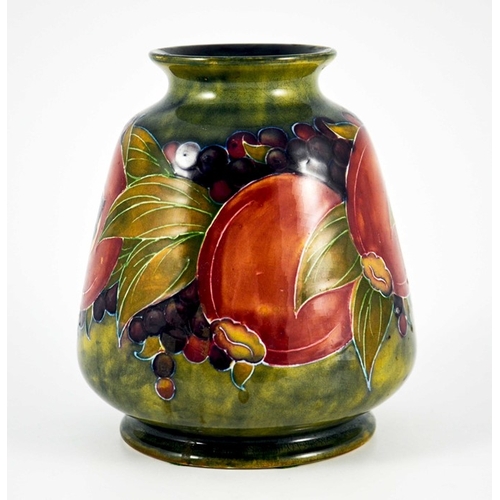 1124 - William Moorcroft, a Pomegranate on ochre vase, circa 1916, conical ovoid form, impressed Burslem ma... 