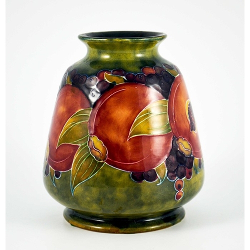 1124 - William Moorcroft, a Pomegranate on ochre vase, circa 1916, conical ovoid form, impressed Burslem ma... 