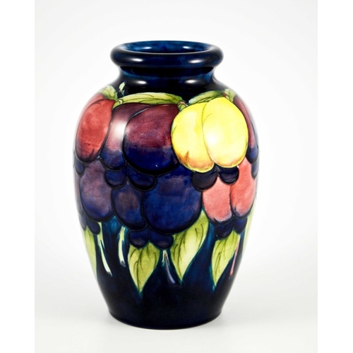 1126 - William Moorcroft, a Wisteria on blue vase, circa 1925, ovoid shouldered form, impressed marks and u... 