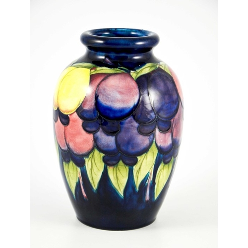 1126 - William Moorcroft, a Wisteria on blue vase, circa 1925, ovoid shouldered form, impressed marks and u... 