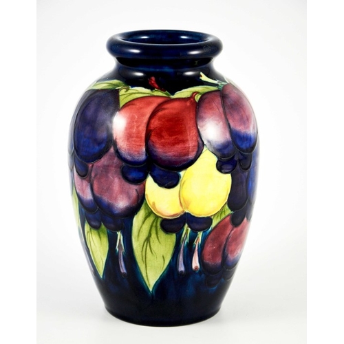 1126 - William Moorcroft, a Wisteria on blue vase, circa 1925, ovoid shouldered form, impressed marks and u... 