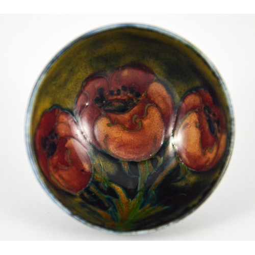 1129 - William Moorcroft, a miniature Big Poppy bowl, circa 1925, footed hemispherical form, impressed mark... 