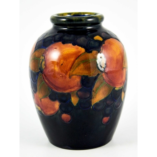 1133 - William Moorcroft, a Pomegranate on blue vase, circa 1925, shouldered form, impressed marks and unde... 