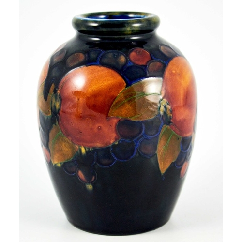 1133 - William Moorcroft, a Pomegranate on blue vase, circa 1925, shouldered form, impressed marks and unde... 