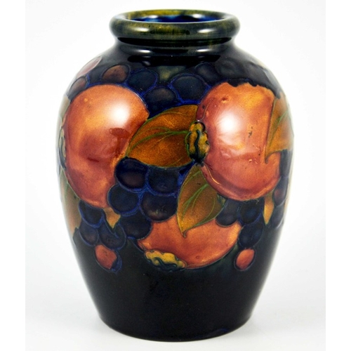 1133 - William Moorcroft, a Pomegranate on blue vase, circa 1925, shouldered form, impressed marks and unde... 