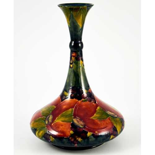 1140 - William Moorcroft, a Pomegranate on ochre vase, circa 1914, ships decanter form with knopped neck, i... 