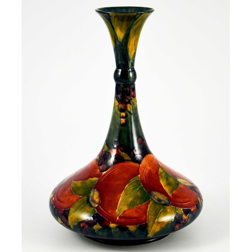 1140 - William Moorcroft, a Pomegranate on ochre vase, circa 1914, ships decanter form with knopped neck, i... 