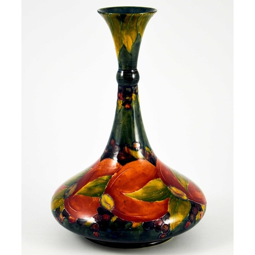 1140 - William Moorcroft, a Pomegranate on ochre vase, circa 1914, ships decanter form with knopped neck, i... 