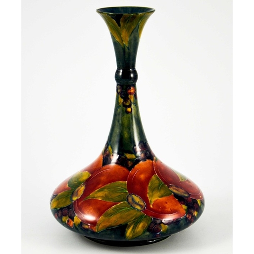 1140 - William Moorcroft, a Pomegranate on ochre vase, circa 1914, ships decanter form with knopped neck, i... 