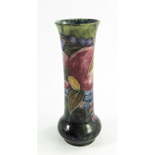 1147 - William Moorcroft, a Pomegranate vase, circa 1916, elongated cylindrical form, impressed Burslem mar... 