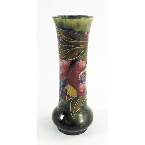 1147 - William Moorcroft, a Pomegranate vase, circa 1916, elongated cylindrical form, impressed Burslem mar... 