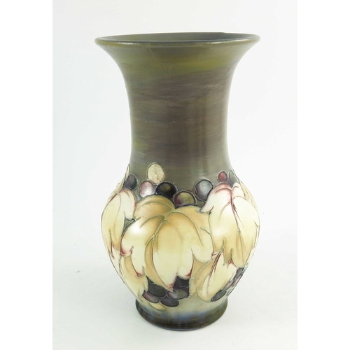 1150 - William Moorcroft, a Leaf and  Grape vase in a matt glaze, circa 1925, baluster form, impressed mark... 