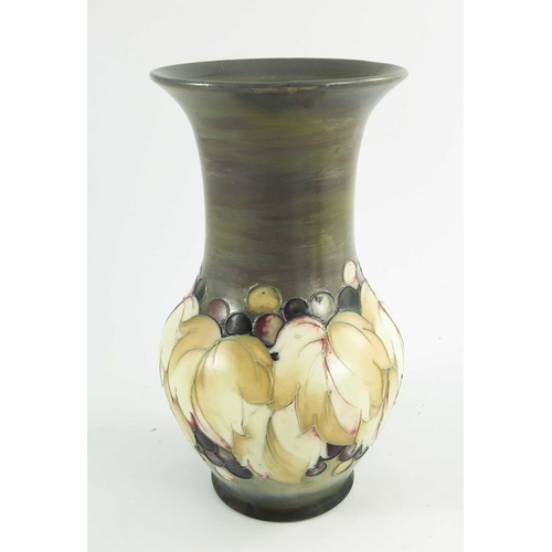 1150 - William Moorcroft, a Leaf and  Grape vase in a matt glaze, circa 1925, baluster form, impressed mark... 