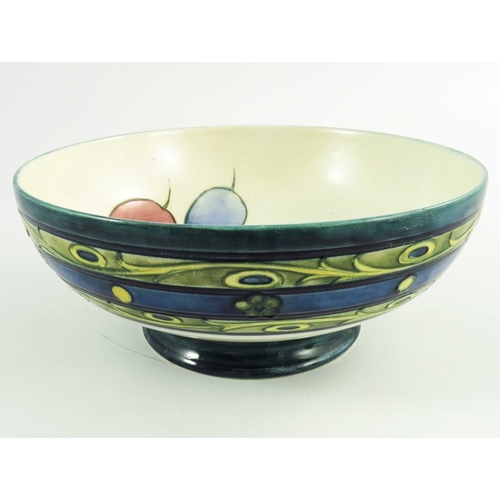 1153 - William Moorcroft, a Late Honesty  bowl, circa 1930, low pedastal form, impressed and painted marks,... 