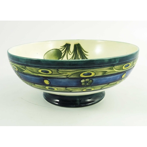 1153 - William Moorcroft, a Late Honesty  bowl, circa 1930, low pedastal form, impressed and painted marks,... 