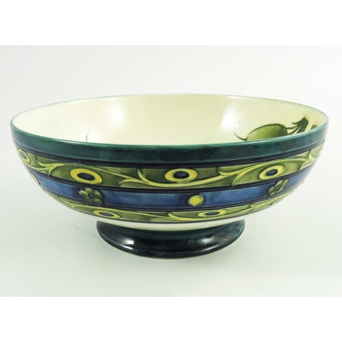 1153 - William Moorcroft, a Late Honesty  bowl, circa 1930, low pedastal form, impressed and painted marks,... 