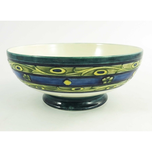 1153 - William Moorcroft, a Late Honesty  bowl, circa 1930, low pedastal form, impressed and painted marks,... 