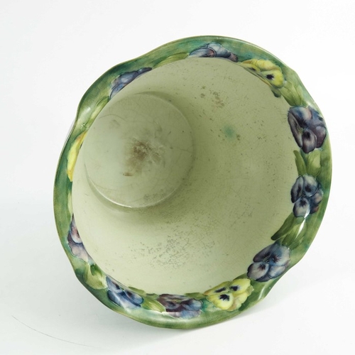 1158 - William Moorcroft, a Pansy on White jardiniere, circa 1910,  painted green signiature, 18cm high