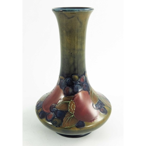 1159 - William Moorcroft, a Pomegranate vase, circa 1925, elongated neck angled baluster form, impressed an... 