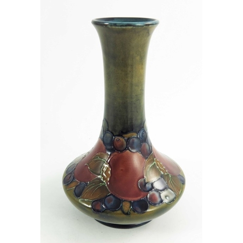 1159 - William Moorcroft, a Pomegranate vase, circa 1925, elongated neck angled baluster form, impressed an... 