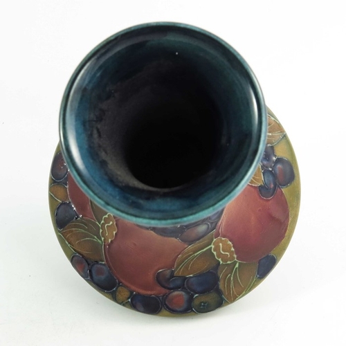 1159 - William Moorcroft, a Pomegranate vase, circa 1925, elongated neck angled baluster form, impressed an... 