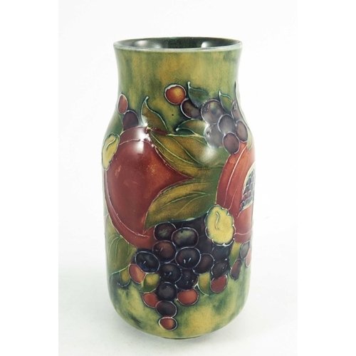 1160 - William Moorcroft, a Pomegranate on ochre vase, dated 1913, cylindrical form with waisted neck, pain... 