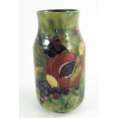 1160 - William Moorcroft, a Pomegranate on ochre vase, dated 1913, cylindrical form with waisted neck, pain... 