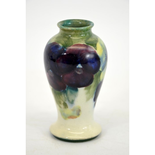 1164 - William Moorcroft, a small Pansy on white vase, circa 1916, inverse baluster form, impressed Burslem... 