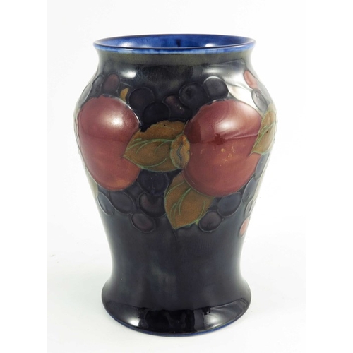 1165 - William Moorcroft, a Pomegranate vase, circa 1925, baluster form, impressed and painted marks, 21cm ... 