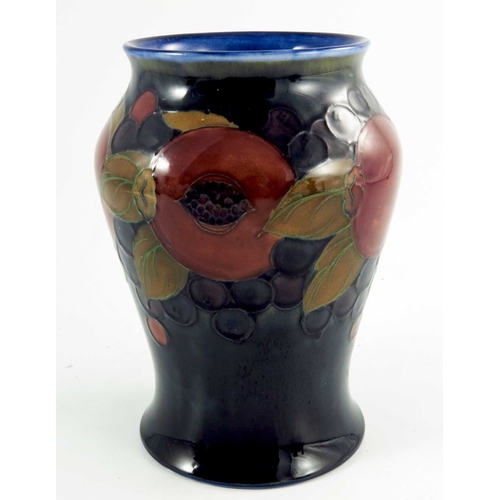 1165 - William Moorcroft, a Pomegranate vase, circa 1925, baluster form, impressed and painted marks, 21cm ... 