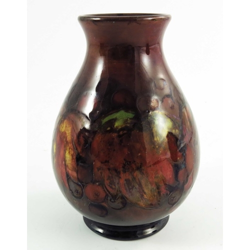 1168 - William Moorcroft, a flambe Leaf and Berry vase, circa 1930, baluster form, impressed and painted ma... 