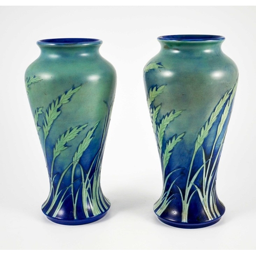 1170 - William Moorcroft, a pair of Waving Corn vases, circa 1935, elongated inverse baluster form, salt gl... 