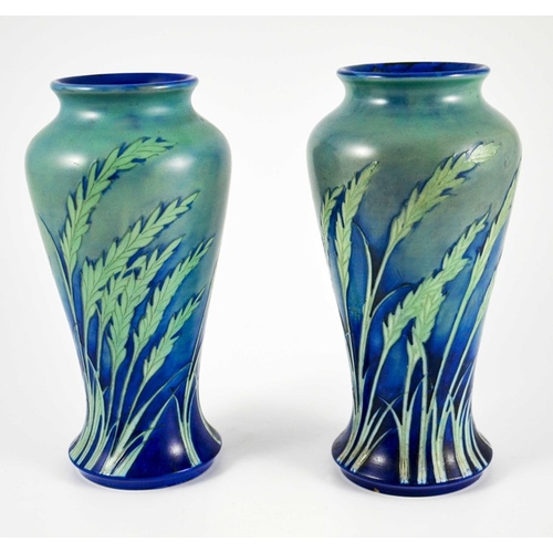 1170 - William Moorcroft, a pair of Waving Corn vases, circa 1935, elongated inverse baluster form, salt gl... 