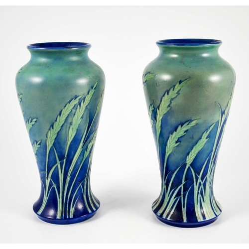 1170 - William Moorcroft, a pair of Waving Corn vases, circa 1935, elongated inverse baluster form, salt gl... 