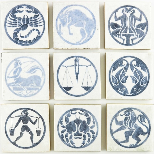 1212 - Polly Brace for Dunsmore, a set of ten Zodiac tiles, circa 1928, each with blue stencilled design, o... 