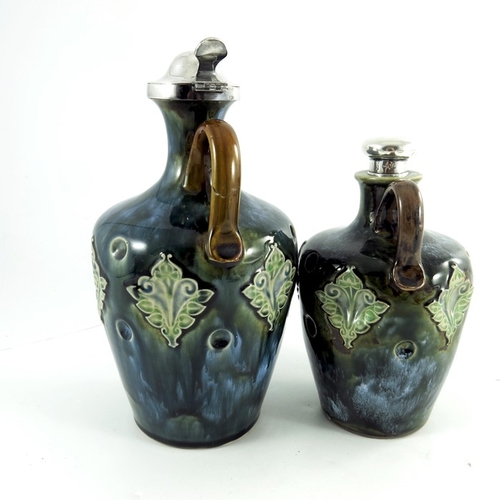 1233 - Two Doulton Lambeth stoneware whisky flagons, circa 1903, each of shouldered form, with dimpled and ... 