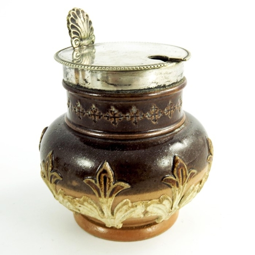 1234 - A Doulton Lambeth stoneware cruet, together with two silver mounted salt cellars, sprigged with leaf... 