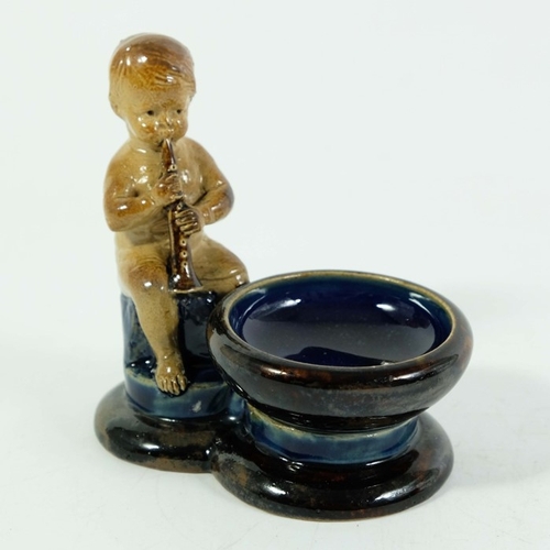 1241 - George Tinworth for Doulton Lambeth, a stoneware figural salt cellar or bibelot, modelled as a boy p... 