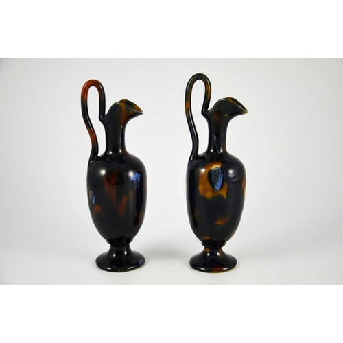 1246 - Bourne Denby, a pair of tortoiseshell stoneware ewers, circa 1860, pedestal ovoid form with elongate... 