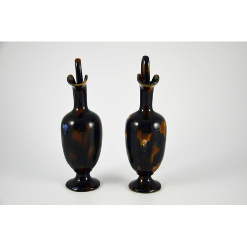 1246 - Bourne Denby, a pair of tortoiseshell stoneware ewers, circa 1860, pedestal ovoid form with elongate... 