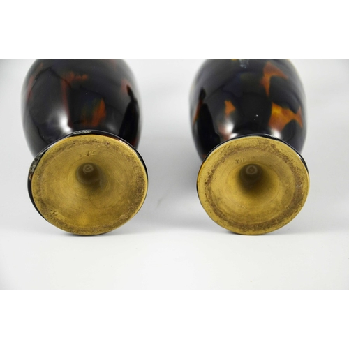 1246 - Bourne Denby, a pair of tortoiseshell stoneware ewers, circa 1860, pedestal ovoid form with elongate... 