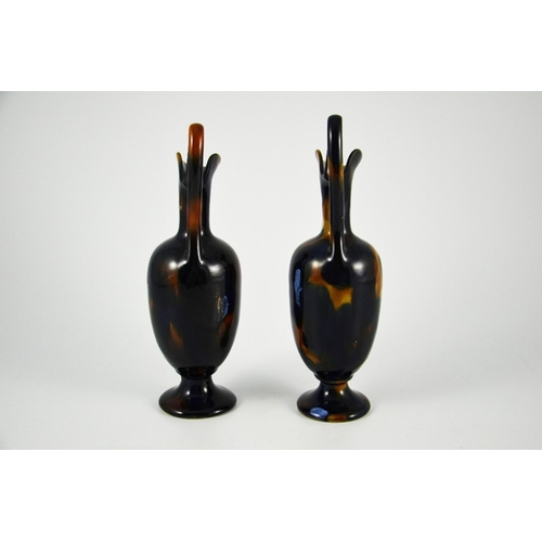 1246 - Bourne Denby, a pair of tortoiseshell stoneware ewers, circa 1860, pedestal ovoid form with elongate... 