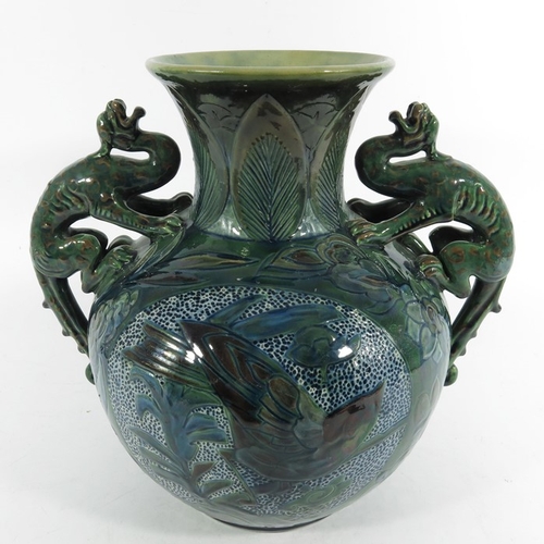 1250 - James Dewdney for C H Brannam, an art pottery twin handled dragon vase, 1898, ovoid form with flared... 